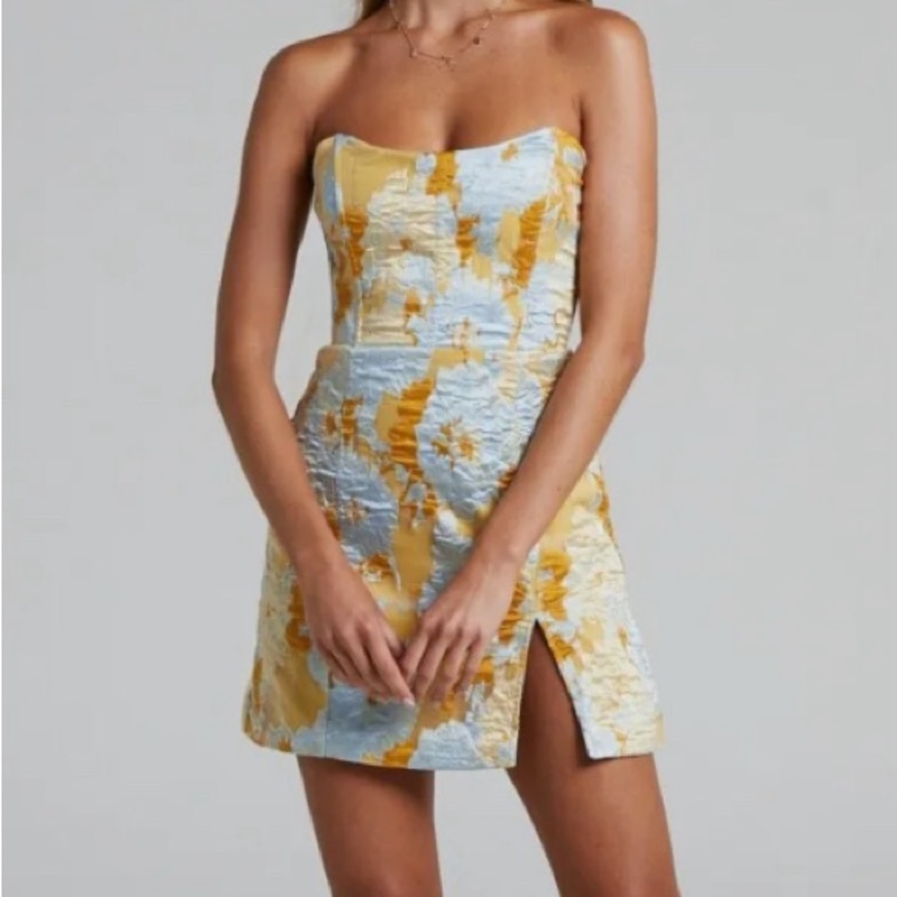 Amazing dress. Just runs small!! Very flattering. New with tags and never worn.